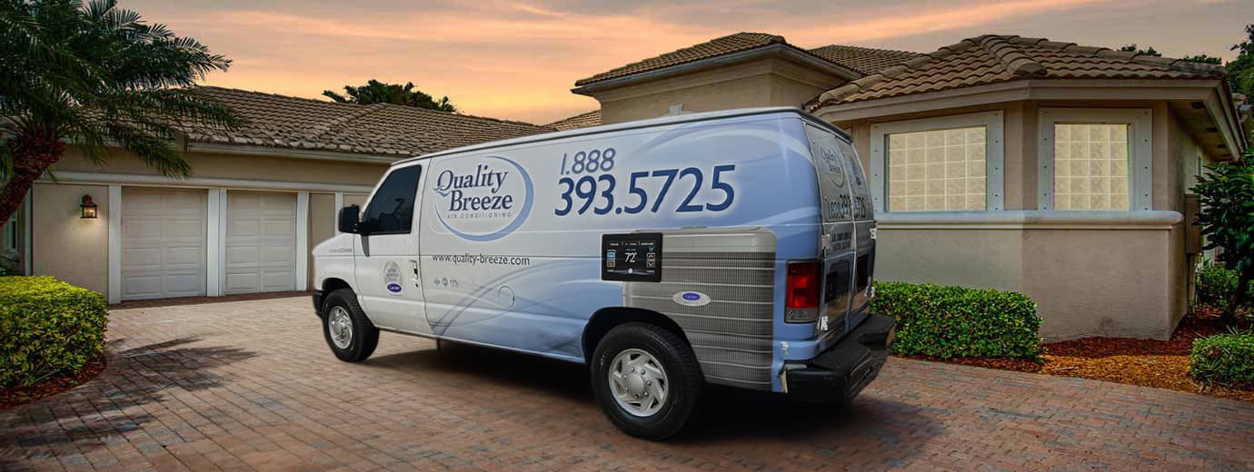 Quality Breeze service van at a South Florida home