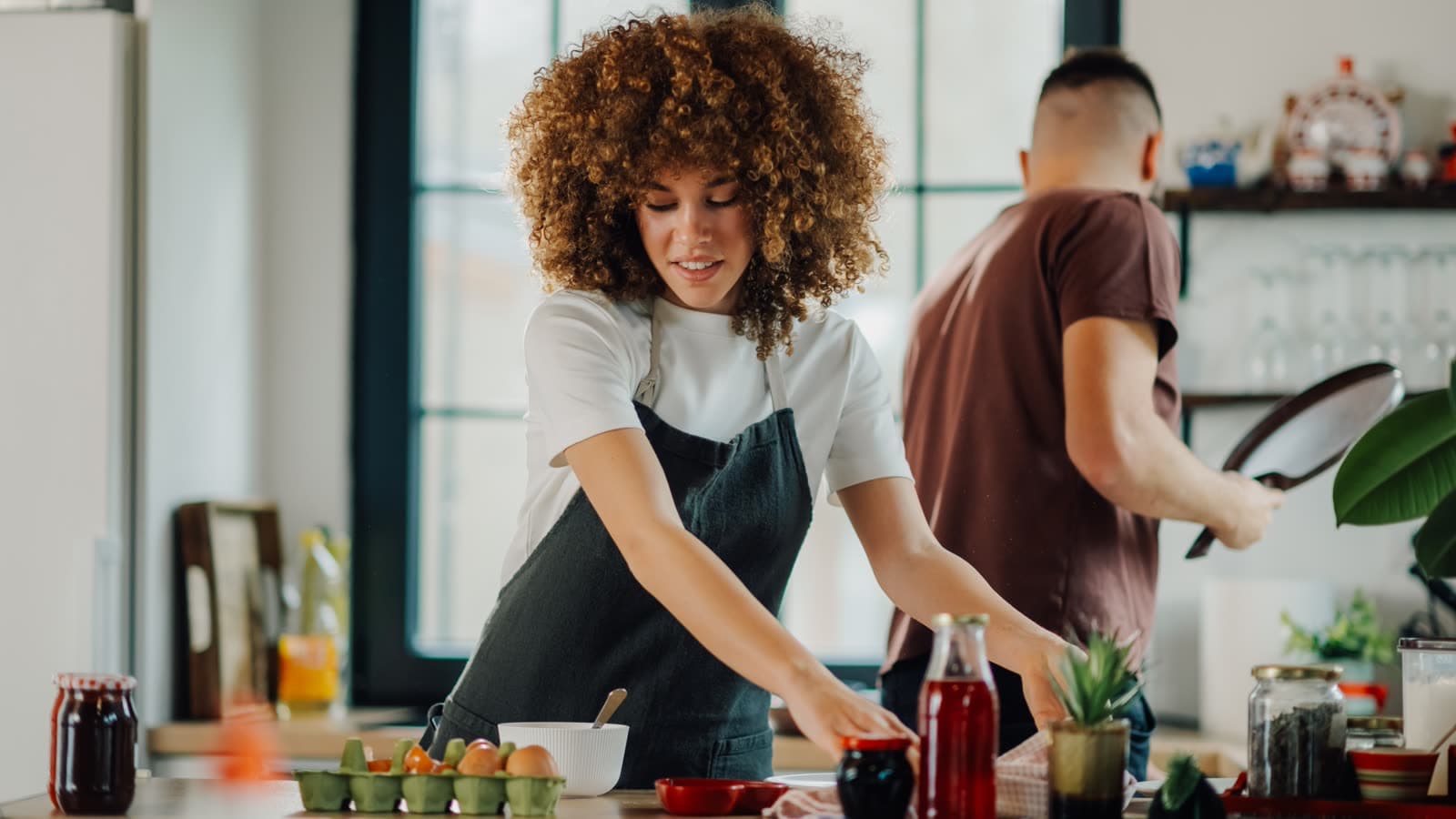 Couple cooking together in a comfortable kitchen