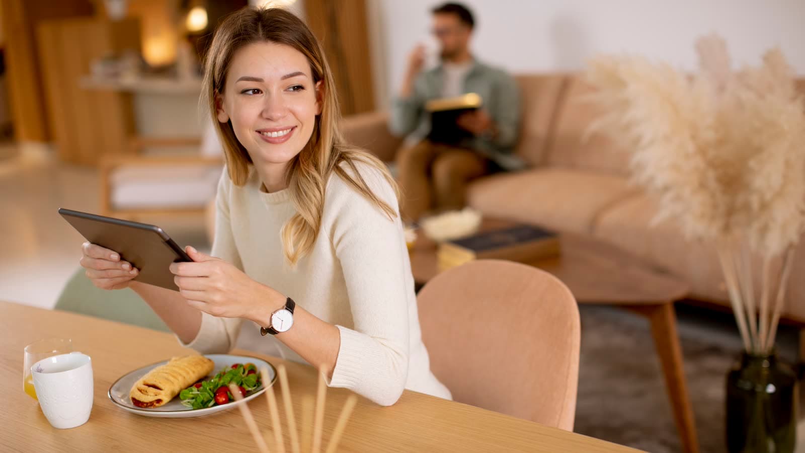 Woman using a smart device at home